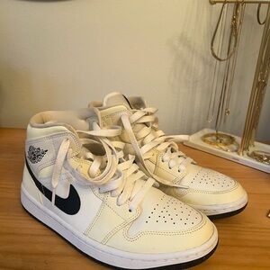 Nike Air Jordan 1 Mid Ivory and Black Sneakers